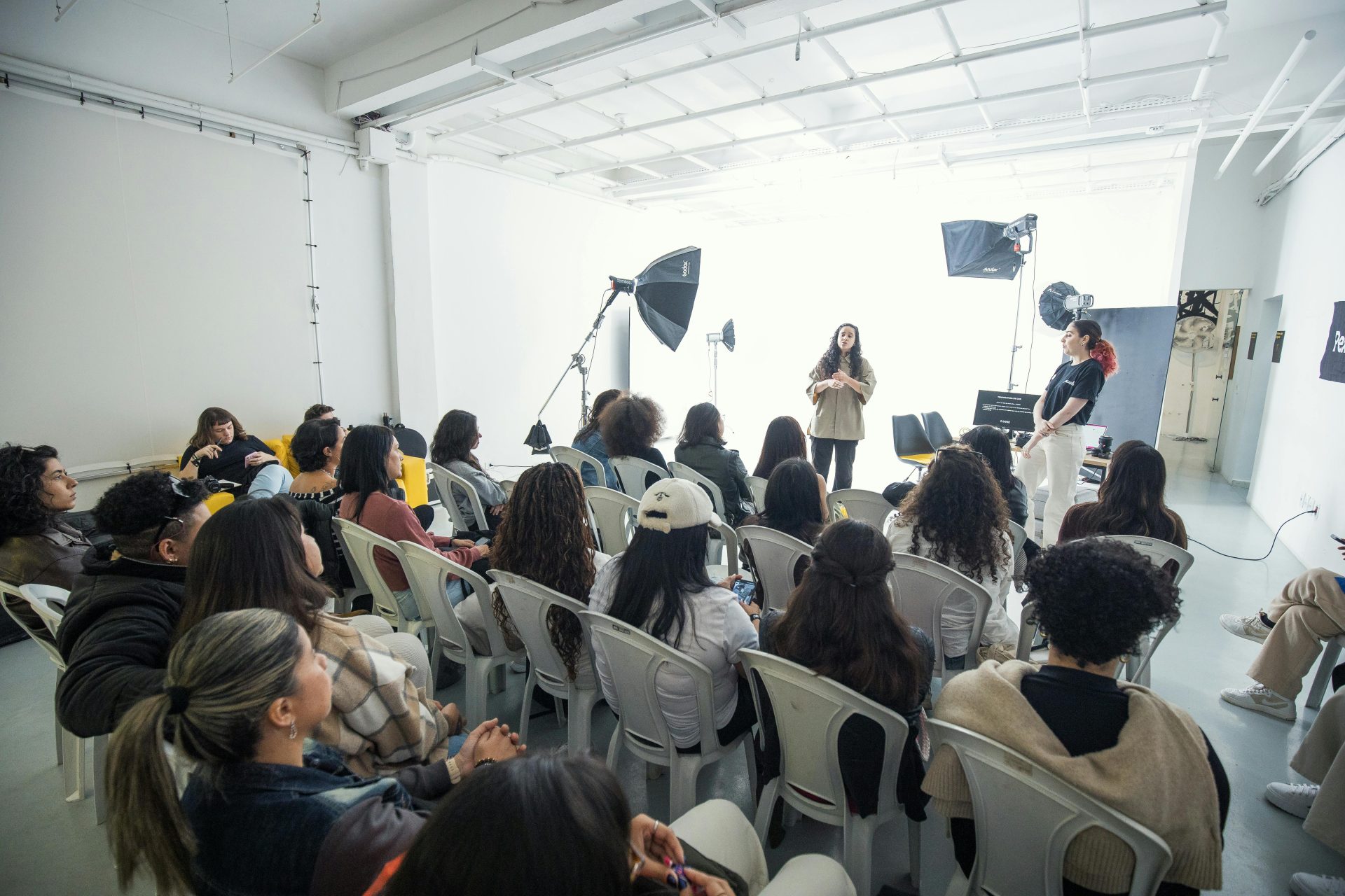 Captivating group workshop in a bright photography studio with diverse participants.